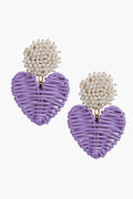 Neely Phelan earrings featuring a cluster of small white beads above woven purple heart-shaped pendants—perfect as lilac dangle earrings or pearl cluster earrings.
