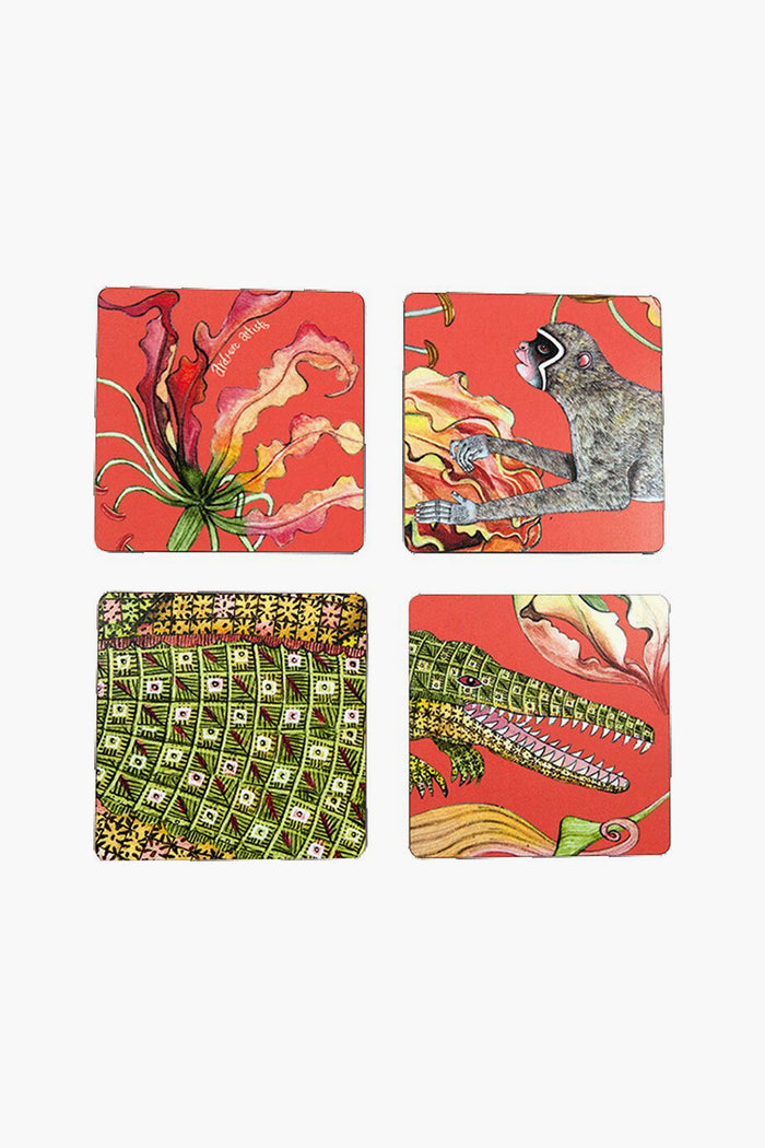 This set of four square coasters by Ardmore Design features colorful illustrations—a flower, a lemur, and two playful crocodile motifs—offering a unique South African-inspired accent to your modern table setting.