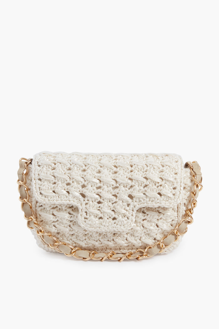 The Caterina Bertini small white crochet bag features a flap closure and gold chain strap, making it a chic woven shoulder bag for any occasion.