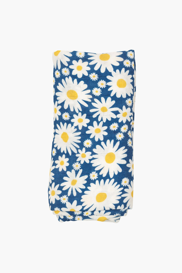 This Angel Dear organic cotton swaddle features large and small white daisies with yellow centers, making it a perfect baby blanket.