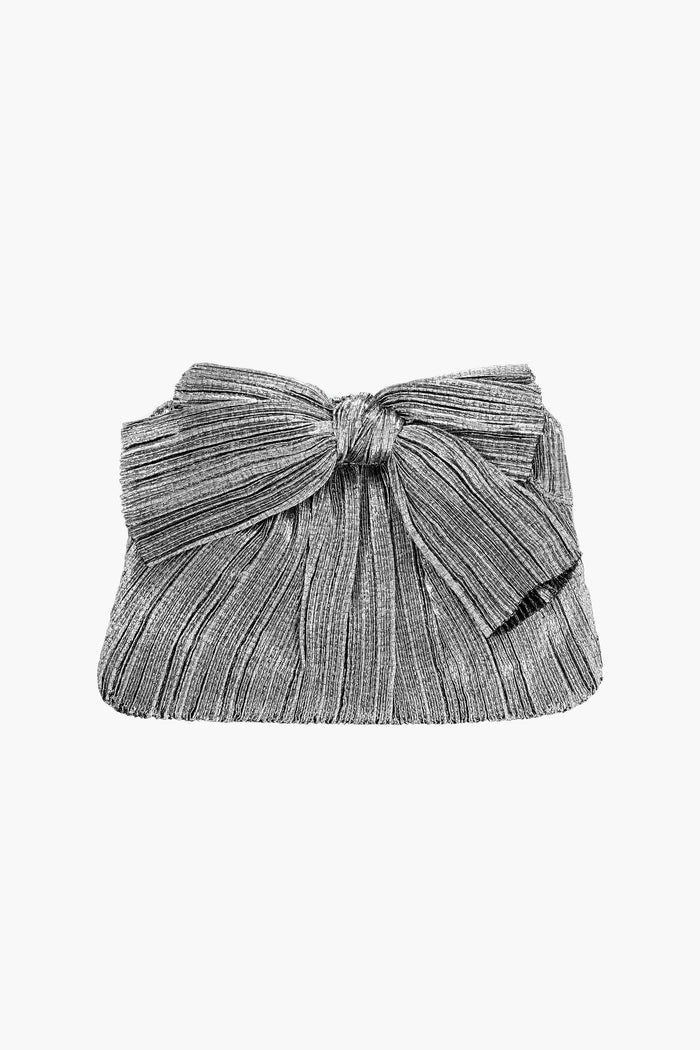 A silver lamé rectangular clutch by Loeffler Randall, featuring pleated fabric and a prominent front bow.