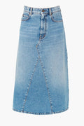 The Weekend Max Mara knee-length A-line denim skirt features light blue wash, front button and zipper closure, belt loops, and paneled seam detailing.
