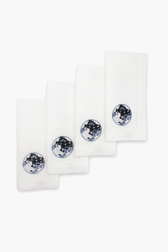 Set of four Chefanie white linen napkins, each with a circular embroidered patch in blue, black, and white—ideal disco ball dinner napkins to elevate any stylish tablescape.