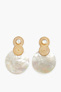 A pair of Divine Pearl Shell Hoops by Ana Carolina Valencia, featuring gold-toned circles and large iridescent round shells—perfect for fans of 24K gold plated jewelry.