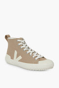 A beige sustainable high top sneaker by VEJA featuring white laces, a white sole, and a stylized white V logo on the side.