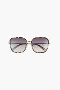 Square tortoiseshell sunglasses from DIFF Eyewear feature gradient lenses, slim temples, and an oversized shape. Viewed from the front, they offer a chic designer look and comfortable fit to elevate your style.
