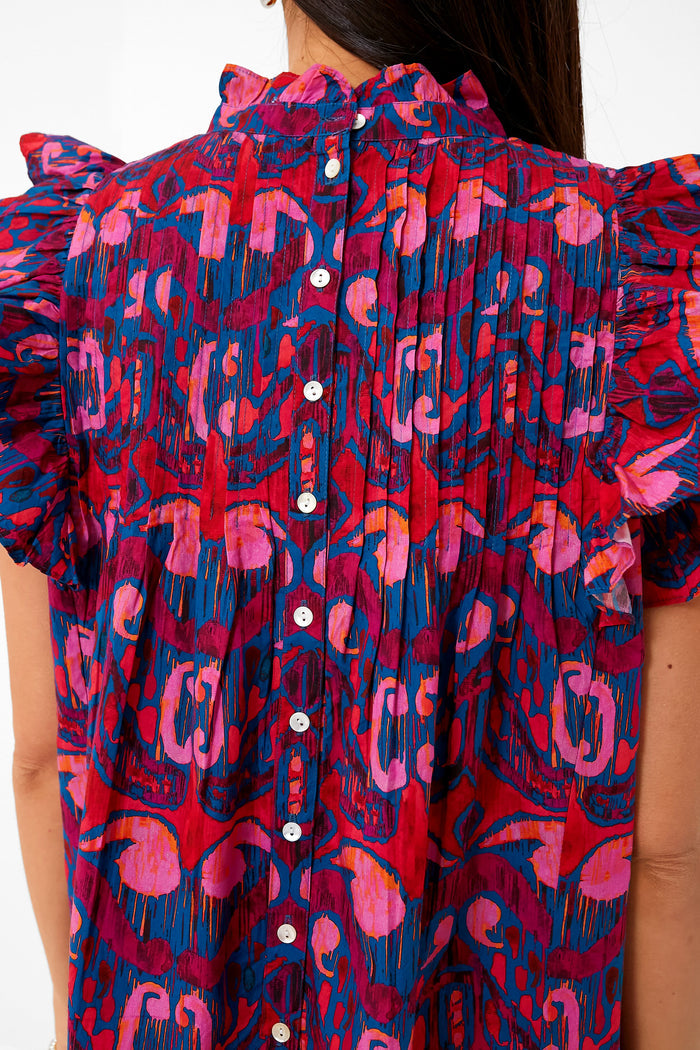 Exclusive Blue Kazak Pintuck Ruffle Top featuring a classic ruffled collar, effortless flutter sleeves, and fun button-down back. Perfect high-end piece for versatile styling.
