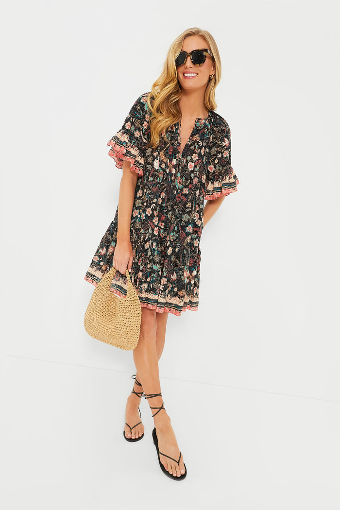 Model wearing Exclusive Tortoise Not Standard Sunglasses, paired with a bohemian floral dress, embodying a classic, effortless style with high-end, fun accessories.
