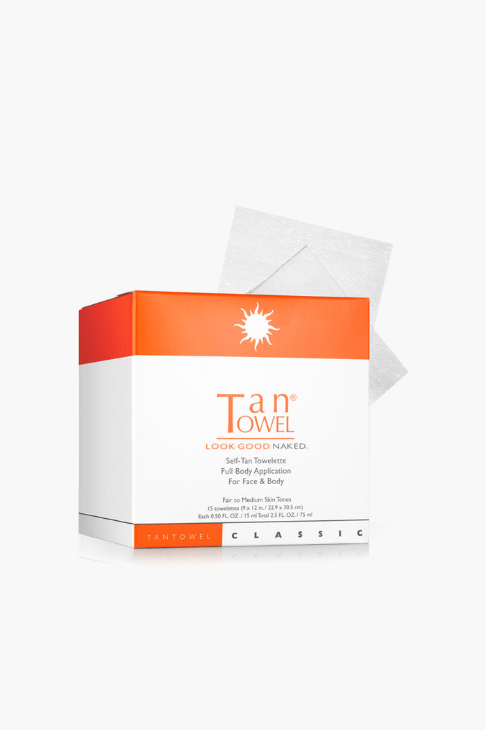 A box of Tan Towel self-tan towelettes by Tan Towel, with two white towelettes partially visible behind the box—ideal for a flawless sunless glow.