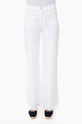 A person wears MOTHER high-rise, white wide-leg jeans with front pockets and frayed hems, paired with dark espadrille shoes.