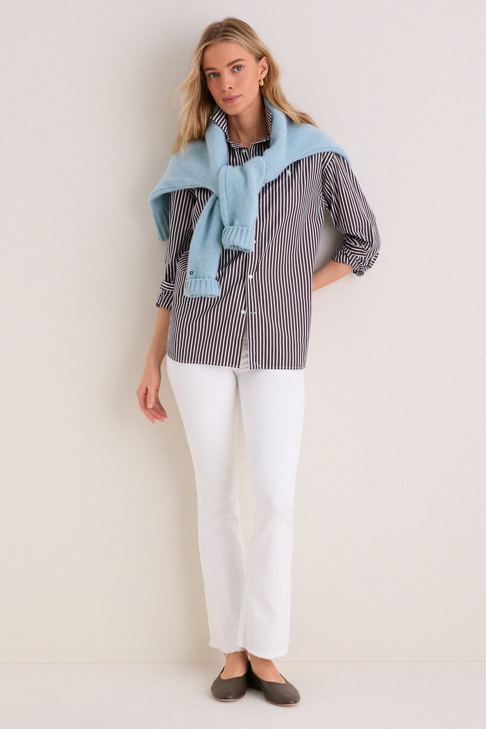 Model in classic Fairest Of Them All The Hustler Ankle Fray jeans, styled effortlessly with a preppy outfit, showcasing a high-end, fun, and flattering look.