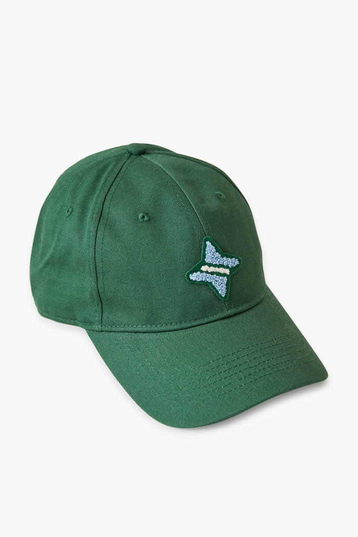 The Tnuck Sport green ball cap features a small blue and white embroidered design on the front left panel and an adjustable back.