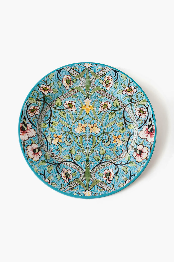 One Hundred 80 Degrees round ceramic plate with a detailed, symmetrical floral pattern in blue, green, pink, yellow, and black.