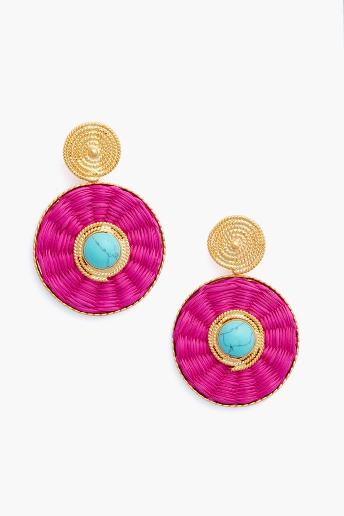 A pair of Ana Carolina Valencia Fuchsia Iraca Lucky Eye Earrings featuring gold textured tops, magenta woven palm discs, and turquoise center stones.