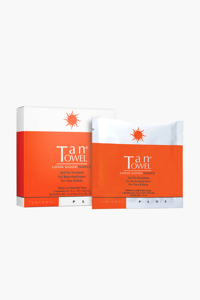 Tan Towel Plus self-tan towelettes come in a white and orange box with matching pouches, both designed and labeled by the Tan Towel brand for full body application.