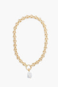 Petit Moments chunky chain necklace features large oval gold-tone links and a unique irregular faux pearl pendant, elegantly displayed.