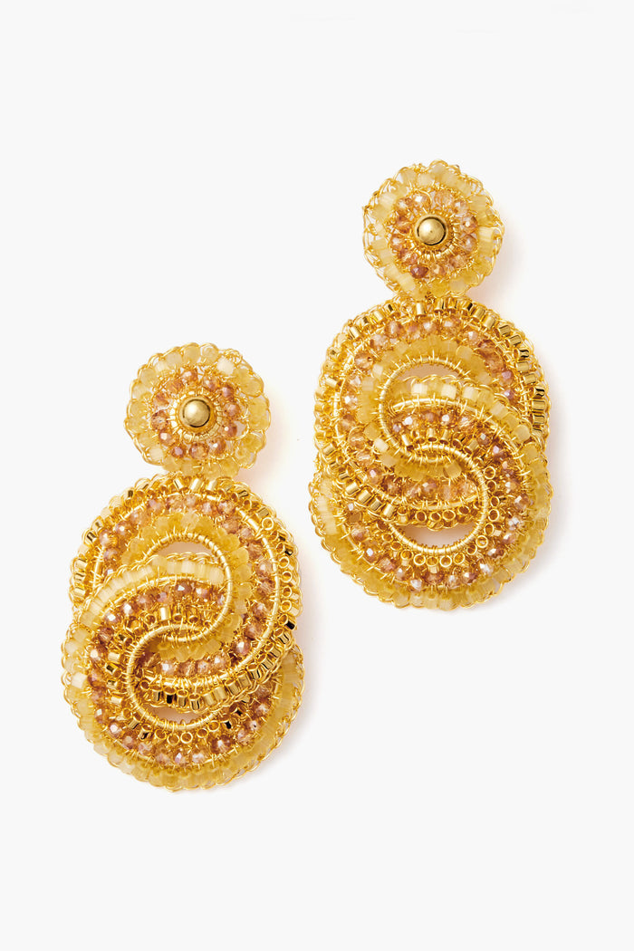 Lavish 18k gold-plated earrings with ornate circular designs and amber beads, featuring intricate beadwork and metallic accents.