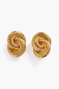 Petit Moments gold-plated brass knot stud earrings showcase an intricate, textured braided design with interlocking details.