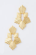 Two gold-toned, fan-shaped Gold Josie Earrings from Tuckernuck Jewelry are elegantly arranged.