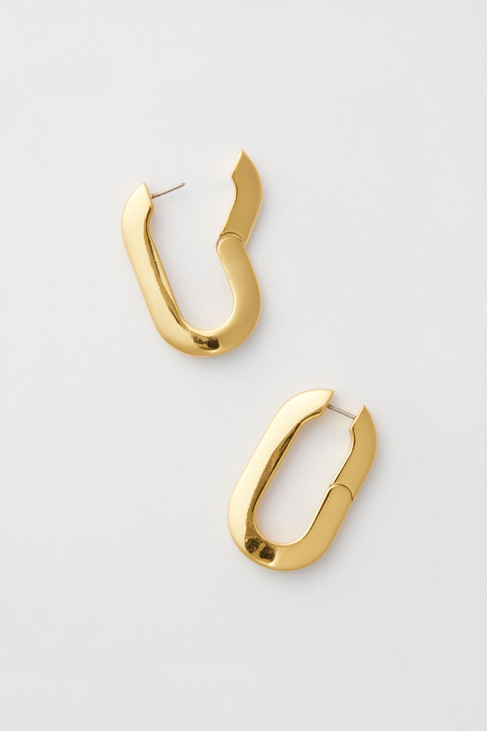 Chunky, oval-shaped hoop earrings with latch back closures from Jenny Bird. These stylish 14K gold-dipped earrings feature a bold gold-tone finish and make a striking statement.