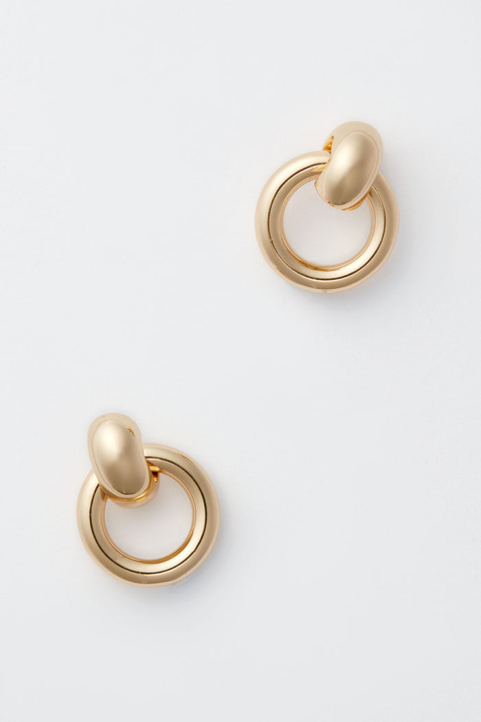 Minimalist gold hoop earrings by Jenny Bird featuring a rounded, smooth design—an ideal addition to any minimalist earring collection.