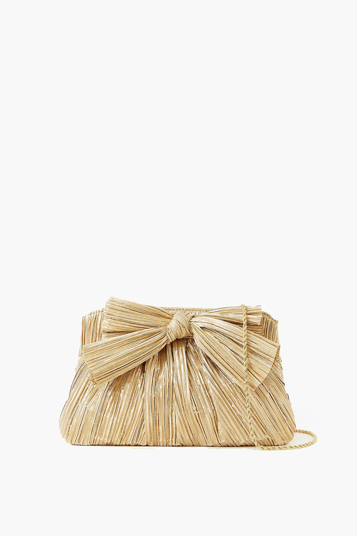 The Loeffler Randall woven straw clutch features a standout bow and slim shoulder strap, adding charm to any outfit.