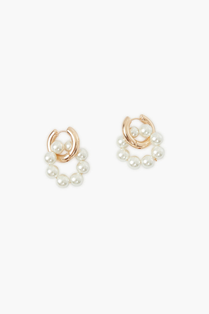 A pair of Petit Moments gold pearl earrings featuring clusters of white pearls in a semicircle at the bottom, perfect for fans of modern gold jewelry.