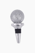 The Mariposa Golf Ball Bottle Stopper is handmade from recycled aluminum, featuring a silver and black golf ball design on top.