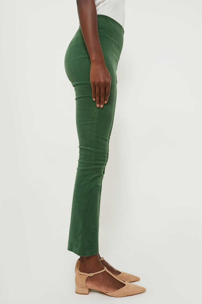 Classic and effortless, the Green Corduroy Ashford Pants feature a high-rise, cropped kick hem, and side zip, offering a fun, high-end style for versatile wear.