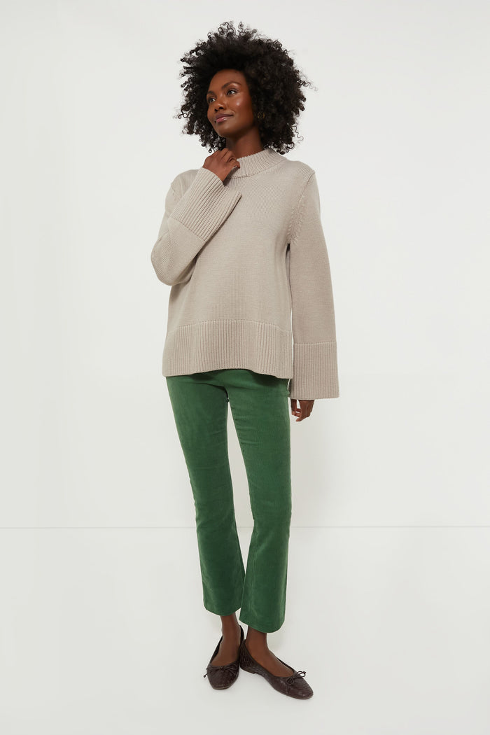 Effortlessly chic Green Corduroy Ashford Pants paired with a classic knit sweater and flats, embodying Tuckernuck's fun, high-end style.
