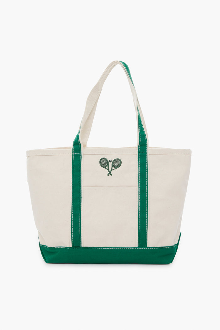 The Tnuck Sport tote features white canvas with green handles and an embroidered design of two crossed tennis rackets on the front, combining style and practicality.