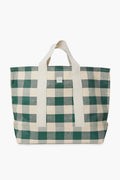Loeffler Randall’s oversized tote features a green and white checkered pattern, cotton woven handles, and a front rectangular logo patch.