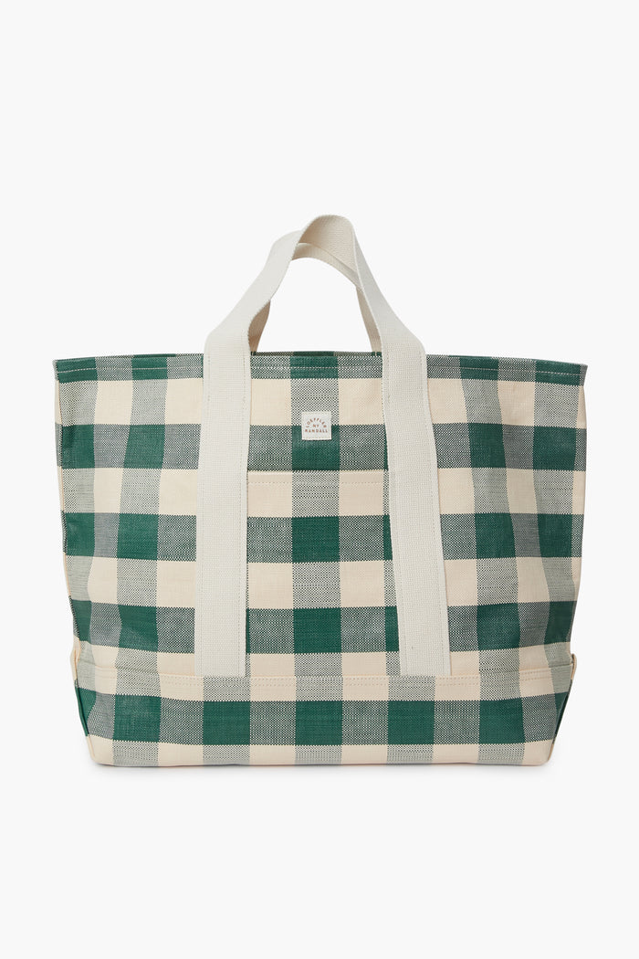 Loeffler Randall’s oversized tote features a green and white checkered pattern, cotton woven handles, and a front rectangular logo patch.