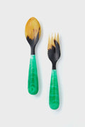 Lily Juliet salad servers feature marbled green handles and yellow-black utensils, creating unique, handcrafted serving pieces that add elegance to any table setting.