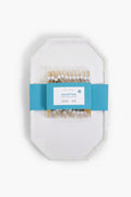 This Two's Company set includes a white chinoiserie serving platter with a faux bamboo-style rim, packaged in a blue paper band and paired with wooden cocktail picks featuring decorative white and blue tops.