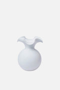 A white, round handmade Vietri vase with a wide, wavy flared opening, inspired by the Hibiscus Glass Fluted Vase design.