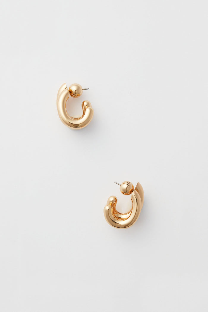 Jenny Bird gold-toned chunky hoop earrings with a curved design—stylish fashion jewelry to elevate any outfit.
