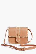 Loeffler Randall tan Italian leather crossbody bag with cream stitching, raffia trim, front flap, buckle detail, and adjustable strap.