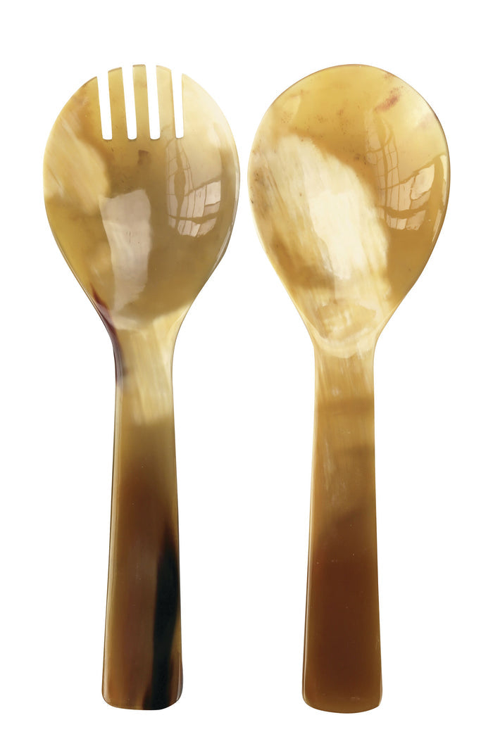 Two horn salad servers—one slotted, one solid—are placed side by side, highlighting an elegant Be Home handcrafted serve set perfect for sophisticated dining.