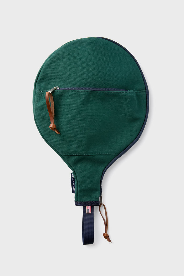 Hudson Sutler’s green fabric paddle racquet cover features a zipper pocket, leather pull tabs, and carrying loop—handcrafted in America for both durability and style in your customizable bags collection.