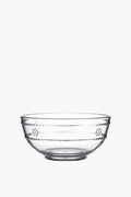 Juliska clear glass bowl with a simple round shape and subtle horizontal grooves, inspired by the Al Fresco Collection, is perfect for versatile serving.