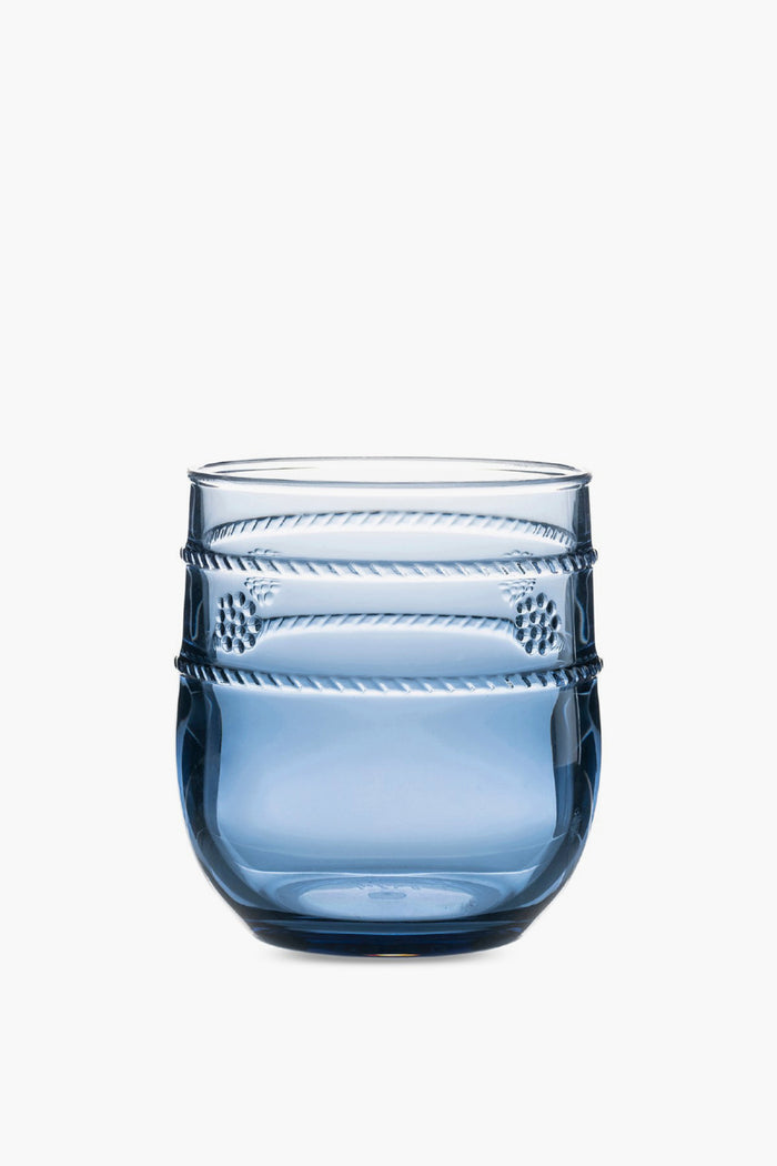 The Juliska Al Fresco tumbler is blue, made from BPA-free acrylic, and features a rounded base with textured horizontal bands near the top. It's dishwasher safe for easy cleaning.