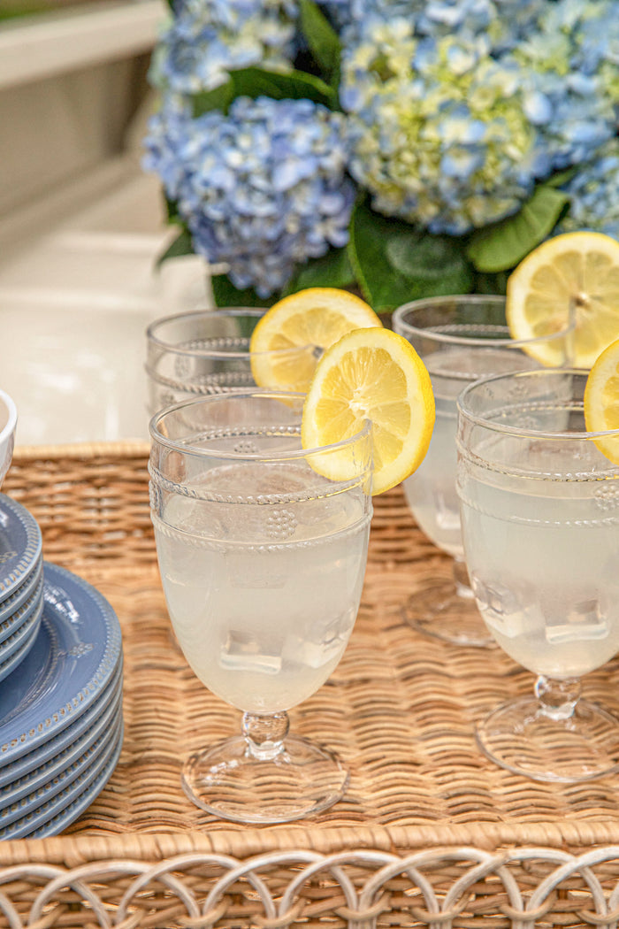 Isabella Acrylic Goblet Set Of 8 displayed in a classic, effortless style with lemonade, showcasing a fun, high-end entertaining option from Juliska's Al Fresco Collection.