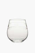 The Juliska clear, round stemless wine glass features a slightly tapered top and decorative horizontal etched lines around the upper half—perfect for outdoor dining.
