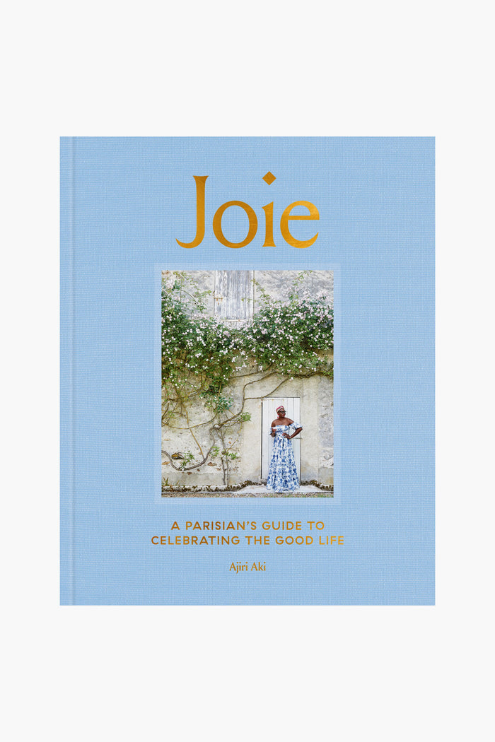 The cover of Joie, by Penguin Random House LLC, depicts a woman amid greenery; its subtitle is A Parisian’s Guide to Celebrating the French joie de vivre by Ajiri Aki.