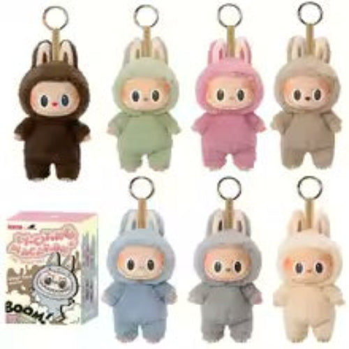 A collection of plush toy figures from the Labubu series, featuring various colors and designs, displayed in a blind box packaging.