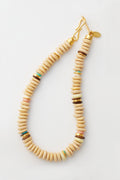The Lizzie Fortunato boho necklace features round beige beads, colorful recycled-glass accents, and a gold clasp—making it a perfect piece of handmade jewelry.