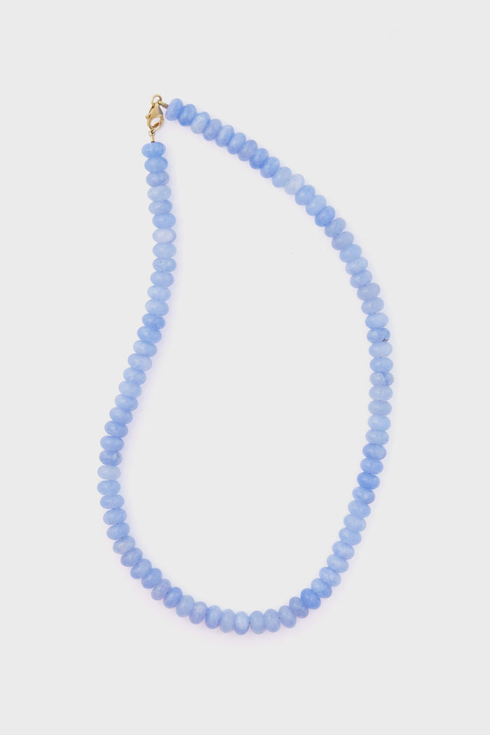 Theodosia's hand-made fine jewelry angelite necklace features round, flat light blue beads and a 14k gold-fill clasp, presented with elegance.