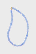 Theodosia's hand-made fine jewelry angelite necklace features round, flat light blue beads and a 14k gold-fill clasp, presented with elegance.