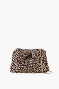 A Loeffler Randall leopard pleated lamé clutch featuring a large front bow and a gold metal chain strap.